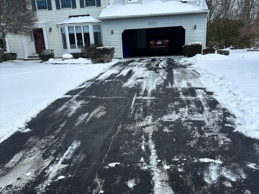 Two-car driveway plowed to its full width right up to the garage door
